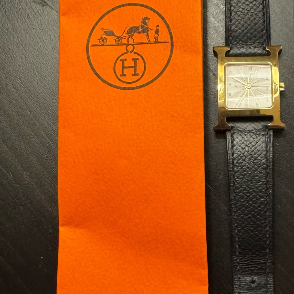 Sold!!! 
Hermès Gold and Black Leather Watch